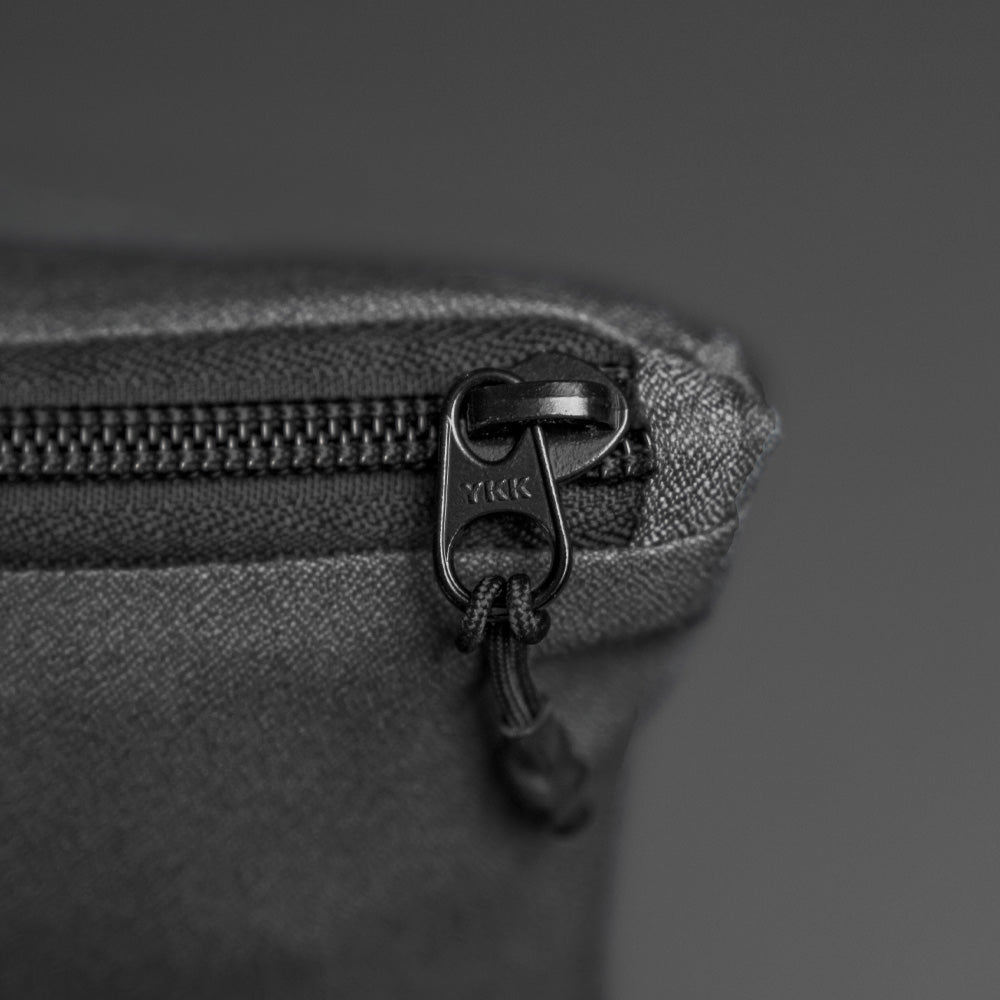 close up view of YKK zipper on packed up beach towel
