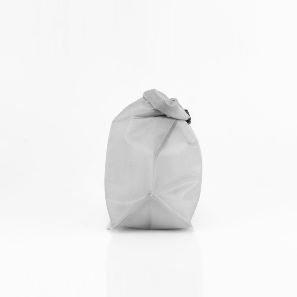 side view of Arctic white waterproof toiletry case on white background