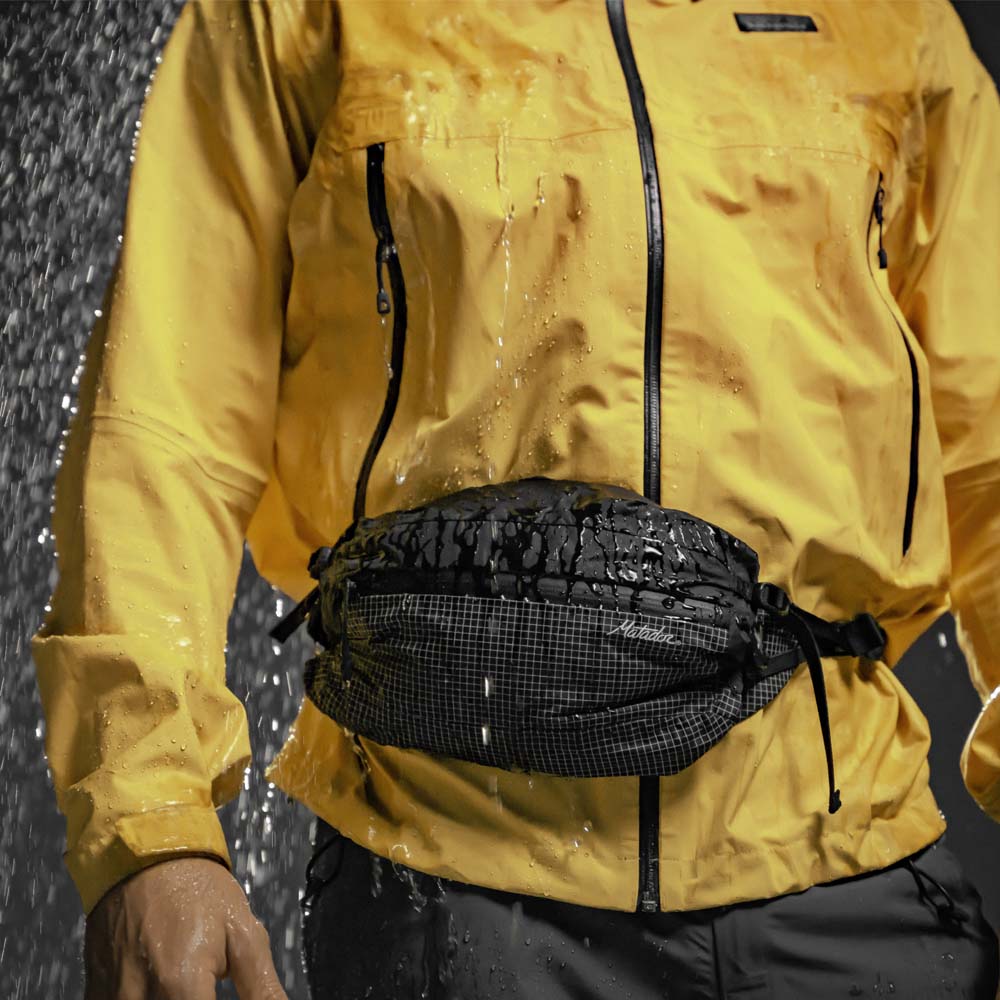 Man wearing hip pack in rain