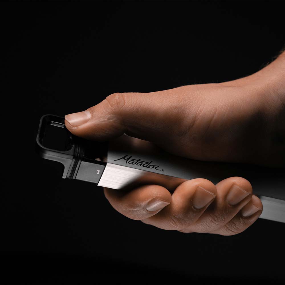 thumb pushing open pill canister