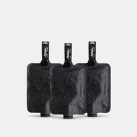 Toiletry bottle 3-pack charcoal on light gray background