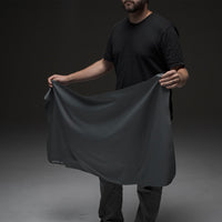 Man holding open towel on black