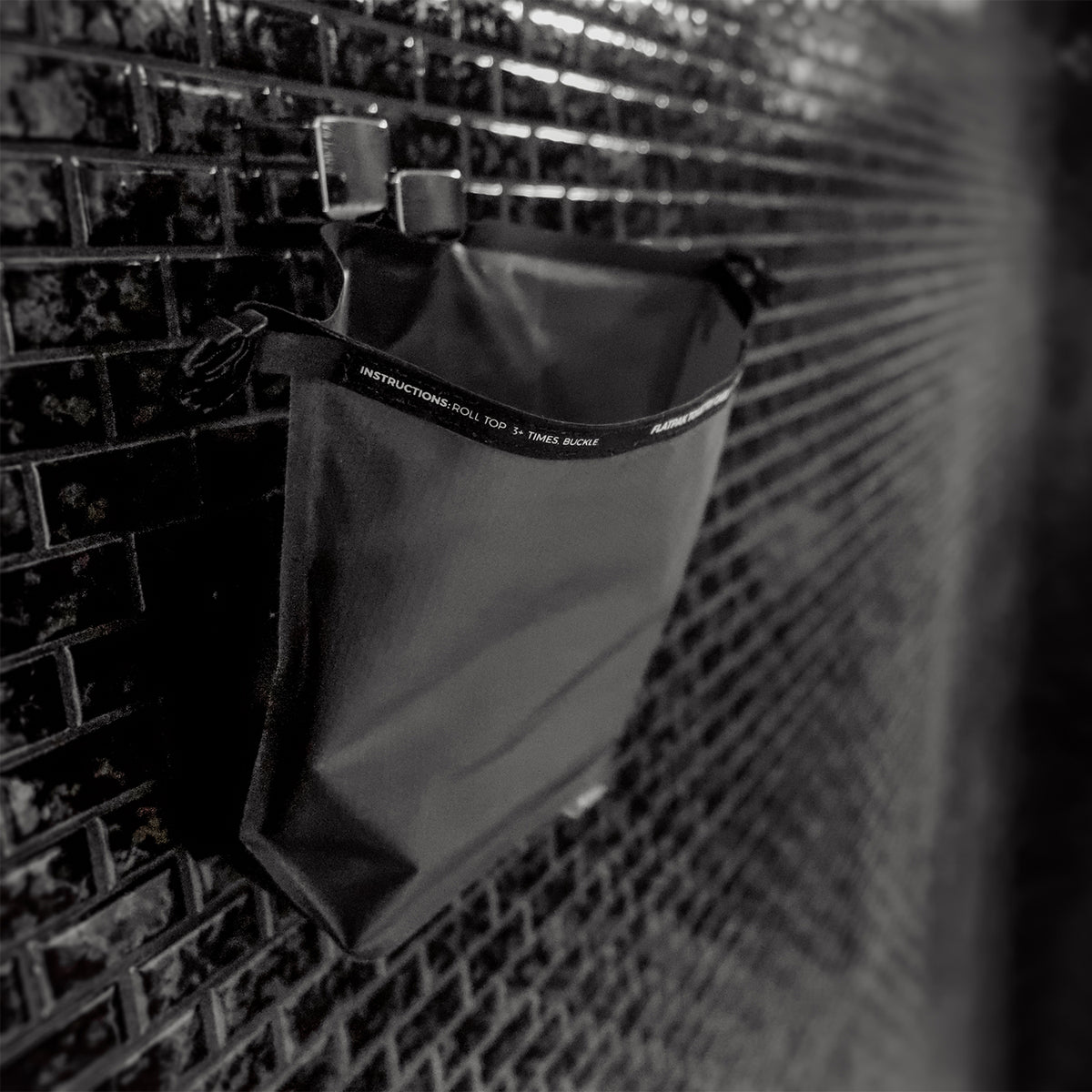 Open FlatPak Toiletry Case hanging on shower hook from hang loop