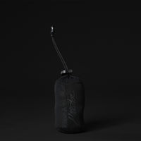 View of packed up towel pouch on black background